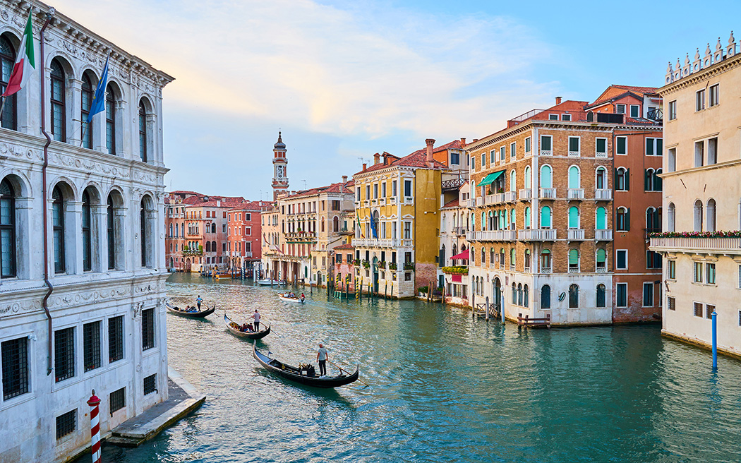 Gondoliers at Sunset on Grand Canal in Venice